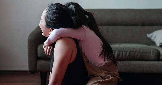 Women and child playing